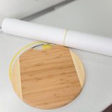 Cutting board and a roll of thick paper